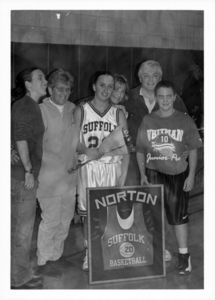 Suffolk University women's basketball player Kate Norton and family celebrating her 100 points milestone, circa 1999