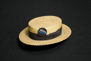 Straw hat with "Put Joe Moakley in Congress" button attached to it