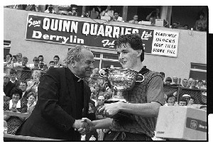 Cardinal Tomás Ó Fiaich Primate of all Ireland (Catholic Church) presents the cup at a GAA football final in Clones, Co. Monaghan