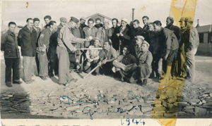 GI explaining baseball to POWs