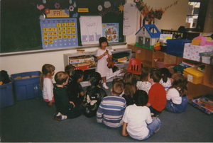 Carrie Sunde demonstrating her violin in kindergarten at Beechwood Knoll Elementary School