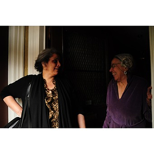 Adelaide Cromwell laughs with Lolita Parker, Jr. in the doorway of Cromwell's home