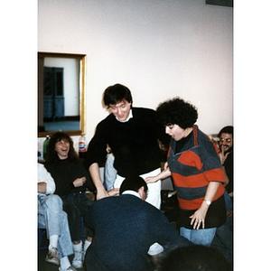 Claudio Ragazzi and two other staff members performing some sort of exercise during a staff retreat.