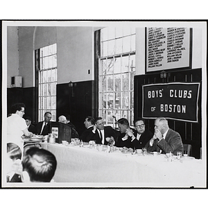 Boys' Club officers and guests eat and converse at the head table during a Boys' Clubs of Boston awards event