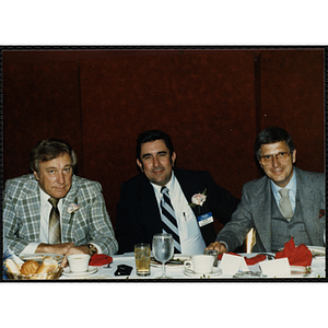 Ron Erhardt, Robert F. Doherty, and Jess Cain, pose together at the 1776 Quarterback Club's Annual New England Patriots Awards Dinner