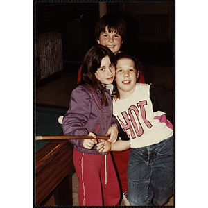 A Group of children playing pool during an open house