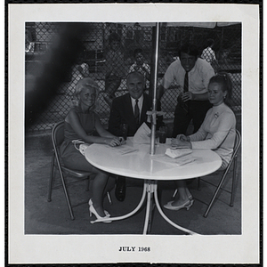 The panel of judges posing for the camera during a Boys' Club Little Sister Contest