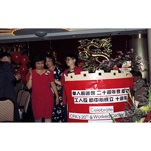 Woman accepts an award at Chinese Progressive Association's 20th Anniversary Celebration
