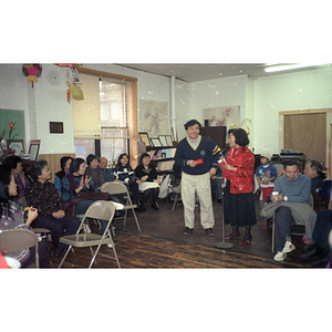 Man and Suzanne Lee after having received an award or gift at the Chinese Progressive Association's celebration of the Chinese New Year