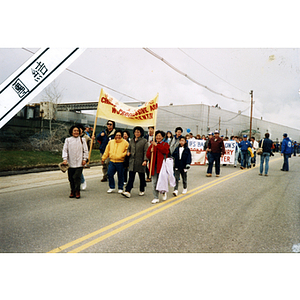 Members of the Chinese Progressive Association Workers' Center march in the International Paper Company strike