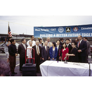 Group portrait of Mayor Menino, officials, and protestors at vistory ceremony