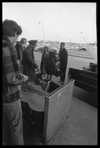 Judy Collins arriving at the airport with luggage in tow and redcap and limousine driver assisting