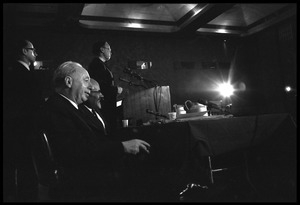 Arthur M. Schlesinger, Jr., speaking at the National Teach-in on the Vietnam War, with other seated panelists Hans J. Morgenthau (left) and Isaac Deutscher
