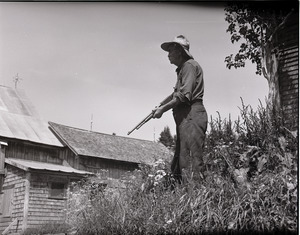 Mr. Kidder hunting with a shotgun