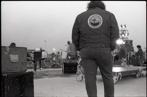 Hollywood Speedway Rock Festival: view from rear stage of group performing and roadie wearing a New Riders of the Purple Sage jacket