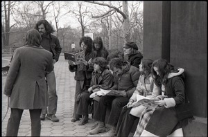 Richard Safft (center) and other commune members sitting by during interview by Channel 5 news