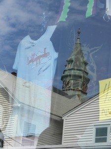 Reflection of Town Hall in a store window on Commercial Street, Provincetown