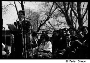 Resistance on the Boston Common: Staughton Lynd addressing the crowd; Noam Chomsky (2nd from right) and Terry Cannon (far right) waiting on stage