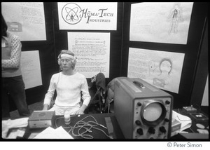 Demonstration of a biofeedback machine at the Huma-Tech Industries booth, Kohoutek Celebration of Consciousness
