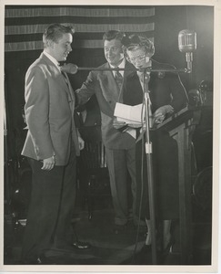 Helen Menken and Arthur Godfrey on stage with young client at Institute Day