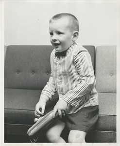 A young boy uses his new prosthetic hand