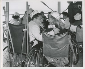 Wheelchair users enjoy a moment on boat ride