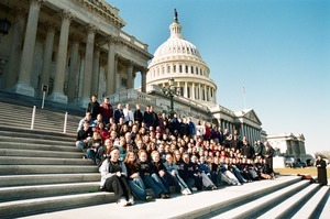 Congressman John W. Olver and group of visitors, posed on the steps of the United States Capitol building