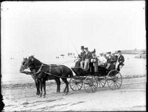 Carriage drawn by two horses on the beach