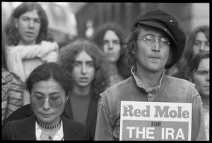 John Lennon holding up a copy of Red Mole (Marxist underground newspaper) and Yoko Ono at a demonstration against the prosecution of Oz Magazine editors on charges of obscenity