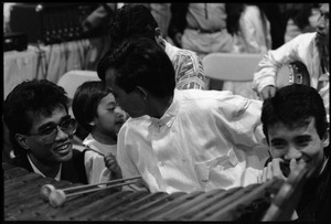 Cambodian New Year's celebration: wooden xylophone player between sets