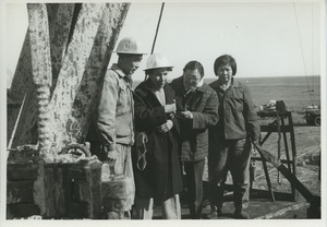 Shirley Graham Du Bois with two unidentified women and one man at an oil well