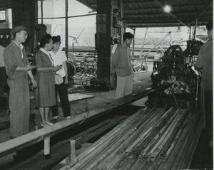 Shirley Graham Du Bois touring a manufacturing plant
