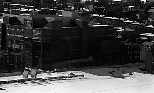 Aerial view of building complex covered in snow