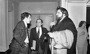 Three unidentified men at the Strand Theatre