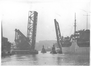 [View of two tugboats passing through the Meridian Street Bridge]