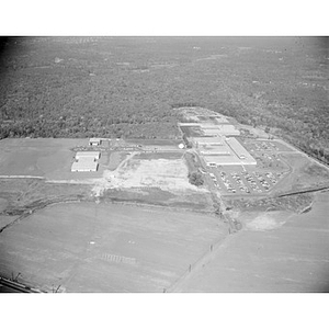 Suburban location of industrial buildings, some new construction, unidentified