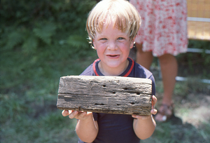 Andrew B. Art with section of joist beam at Moon Barn Raising at entrance to Hopkins Forest on 2 August 1975.