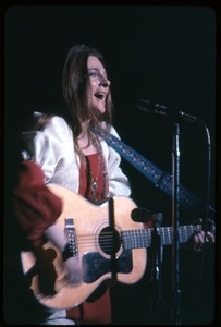 Judy Collins: with guitar, performing on stage