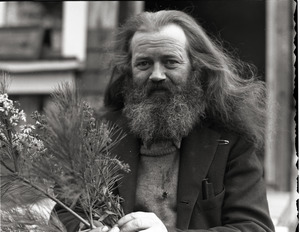 Charles Coffin, The Maine Hermit, seated by a piano