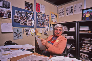 Delores Krieger holding open bulletin