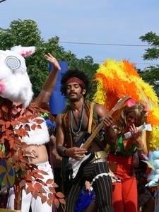 Parade marcher with electric guitar, dressed after Jimi Hendrix : Provincetown Carnival parade