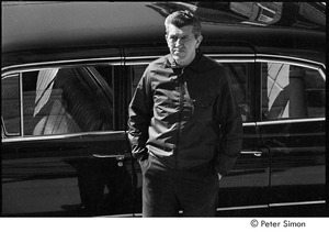 Jack Kerouac's funeral: man standing in front of a car