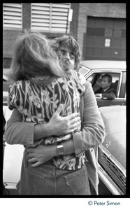 Bonnie Raitt (right) hugging Michael McDonald