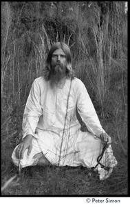 Bhagavan Das: full length portrait seated in a lotus position, facing the camera