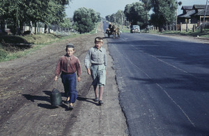 Two boys along a rural road