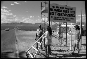 Peace encampment activists talking a security guard at the entrance to the Nevada Test Site