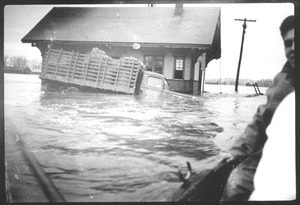 Flooded farm truck and building
