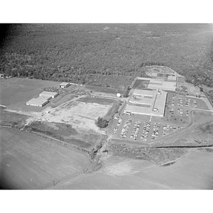 Suburban location of industrial buildings, some new construction, unidentified