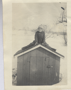 Art G. Rosenburg sitting on shed
