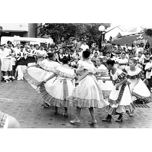 Teenage dancers perform a folk dance in the plaza during Festival Betances.